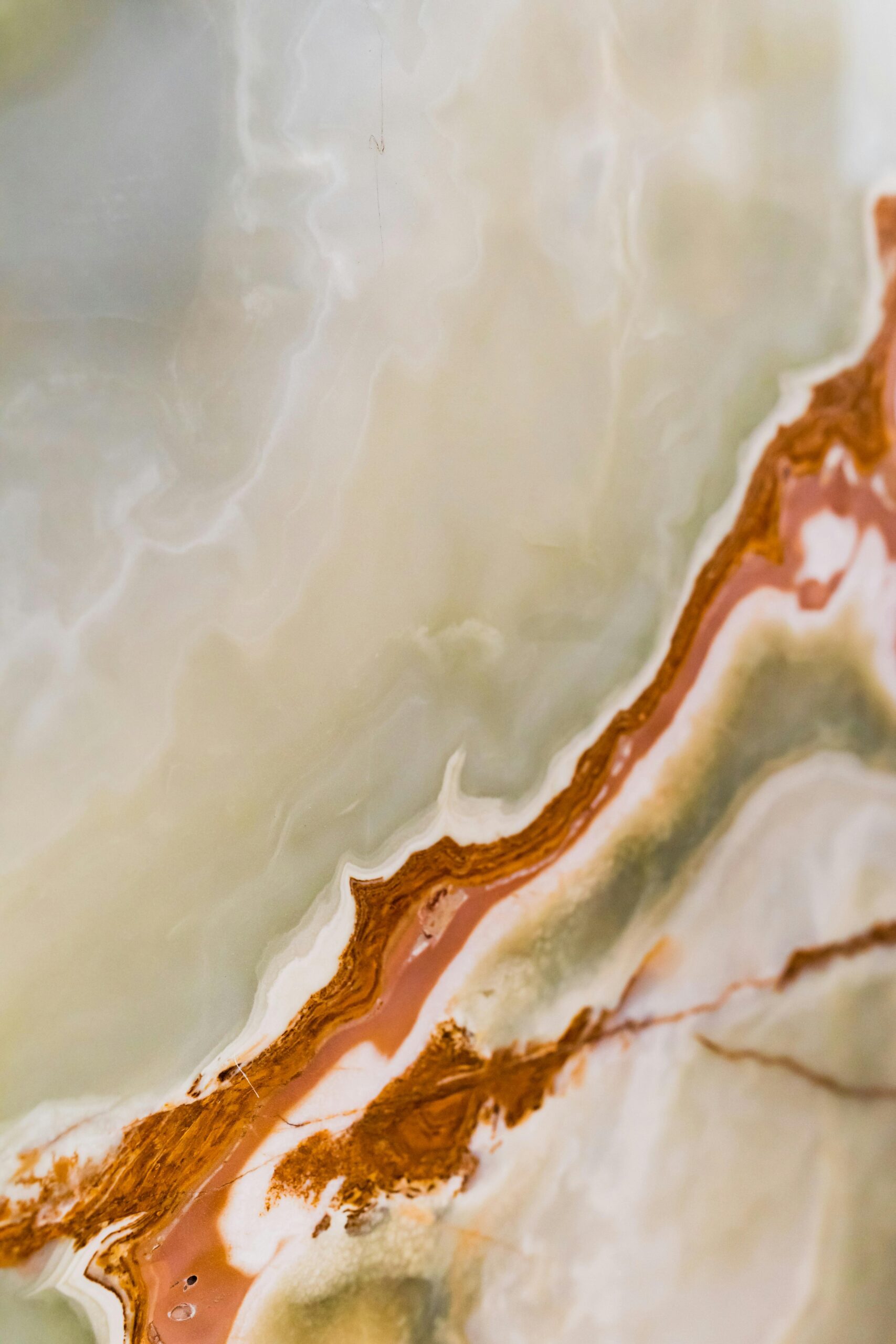 Beautiful abstract marble pattern with earthy tones and intricate textures.